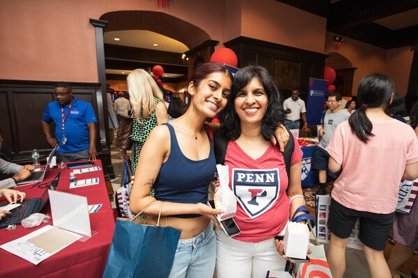 penn family in houston hall during orientation event